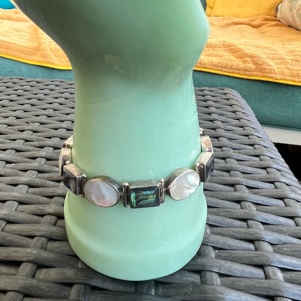 Sajen sterling silver bracelet with abalone and mother of pearl inset panels.